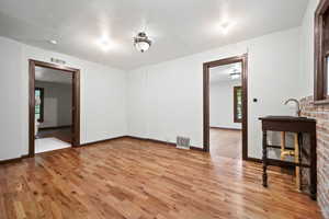 Empty room featuring light wood-type flooring