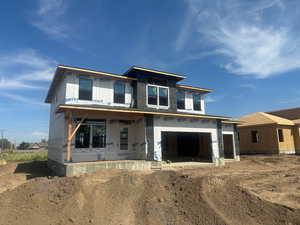 Property under construction featuring covered porch