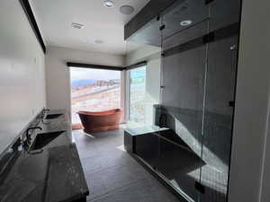 Bathroom featuring heated floors, steam shower & copper tub