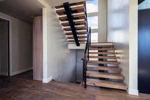 Walnut floating stairs with powder coat railing