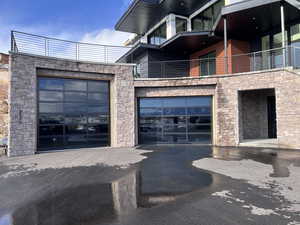 View of building exterior featuring a garage