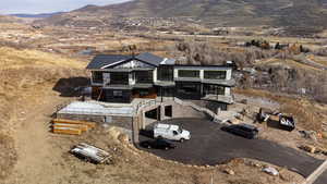 Birds eye view of property with a mountain view