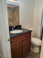 Bathroom featuring toilet and vanity