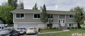 Split foyer home featuring a garage