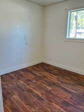 Spare room with hardwood / wood-style floors