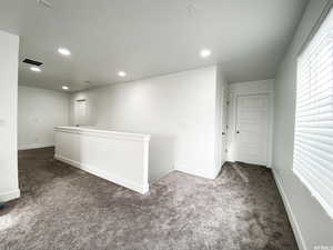 Upstairs hallway with access to the 3 upstairs bedrooms, large full bathroom and laundry room.