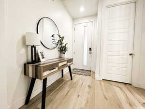 Spacious well lit entryway with natural light from the front door to the sliding back doors.