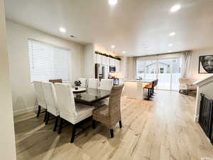 Spacious entry to an open dining and kitchen with natural light you can feel from the front door.