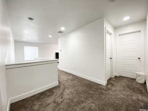 Upstairs hallway with access to the 3 upstairs bedrooms, large full bathroom and laundry room.