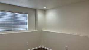 Spare room with a textured ceiling