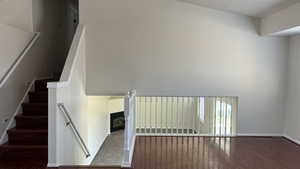 Stairs featuring hardwood / wood-style floors