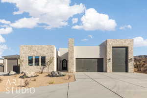 View of front of property with a garage