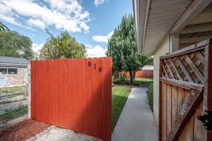 Entrance through gate to rear unit