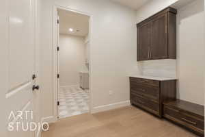 Hallway featuring light hardwood / wood-style flooring