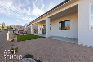 Rear view of property with a patio area