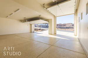 Garage featuring a garage door opener