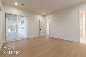 Spare room with light hardwood / wood-style flooring