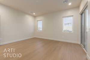 Unfurnished bedroom featuring light hardwood / wood-style flooring