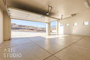 Garage with a mountain view and a garage door opener