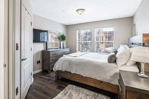 Bedroom featuring dark hardwood / wood-style floors