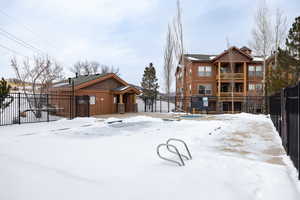 Snow covered house with a balcony