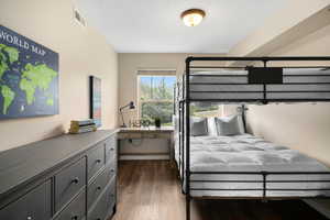 Bedroom featuring dark hardwood / wood-style flooring