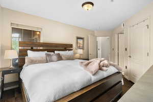 Bedroom featuring dark wood-type flooring