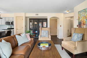 Living room featuring dark wood-type flooring