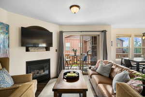 Living room with hardwood / wood-style flooring