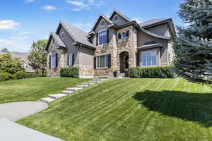 View of front of property with a front yard