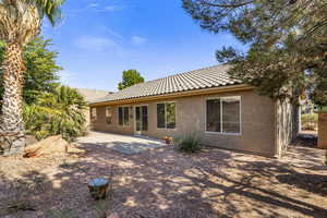 Back of house featuring a patio area and french doors