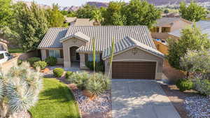 Mediterranean / spanish-style house featuring a garage