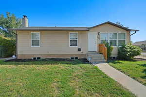 View of front of property with a front yard