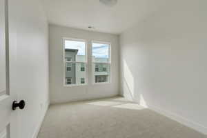 Unfurnished room featuring carpet floors