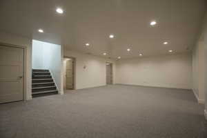 Spare room featuring light colored carpet