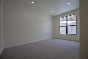 View of carpeted spare room