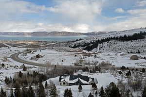 Snowy aerial view featuring a mountain view