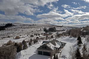 Snowy aerial view with a mountain view