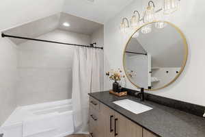 Full bathroom featuring shower / bath combination with curtain, vanity, and recessed lighting