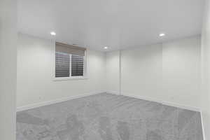 Empty room featuring carpet and recessed lighting