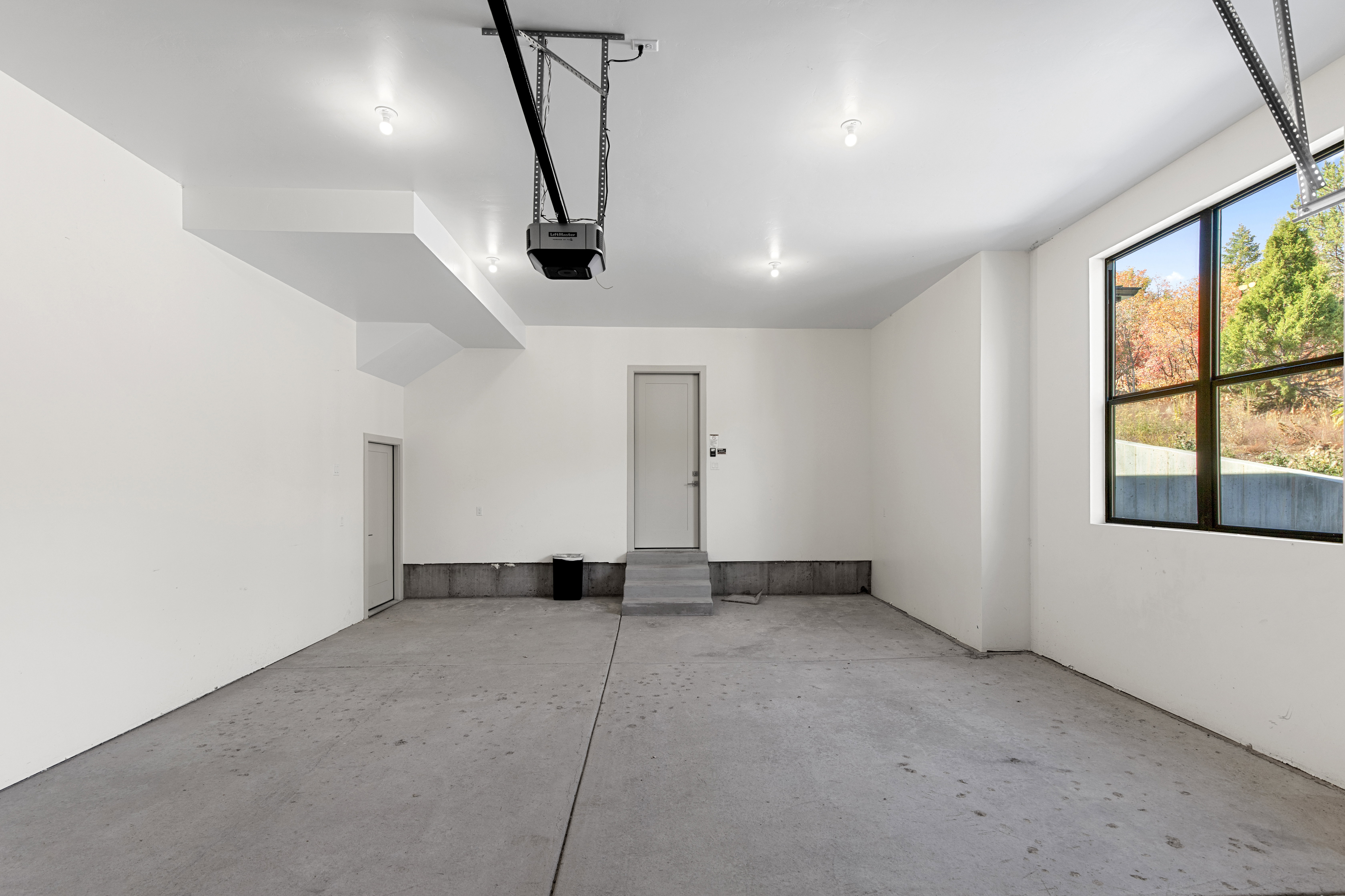 Garage featuring a garage door opener