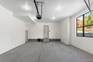 Garage featuring a garage door opener