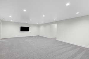 Basement featuring light colored carpet and recessed lighting