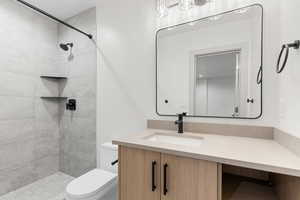 Full bathroom featuring vanity and a stall shower