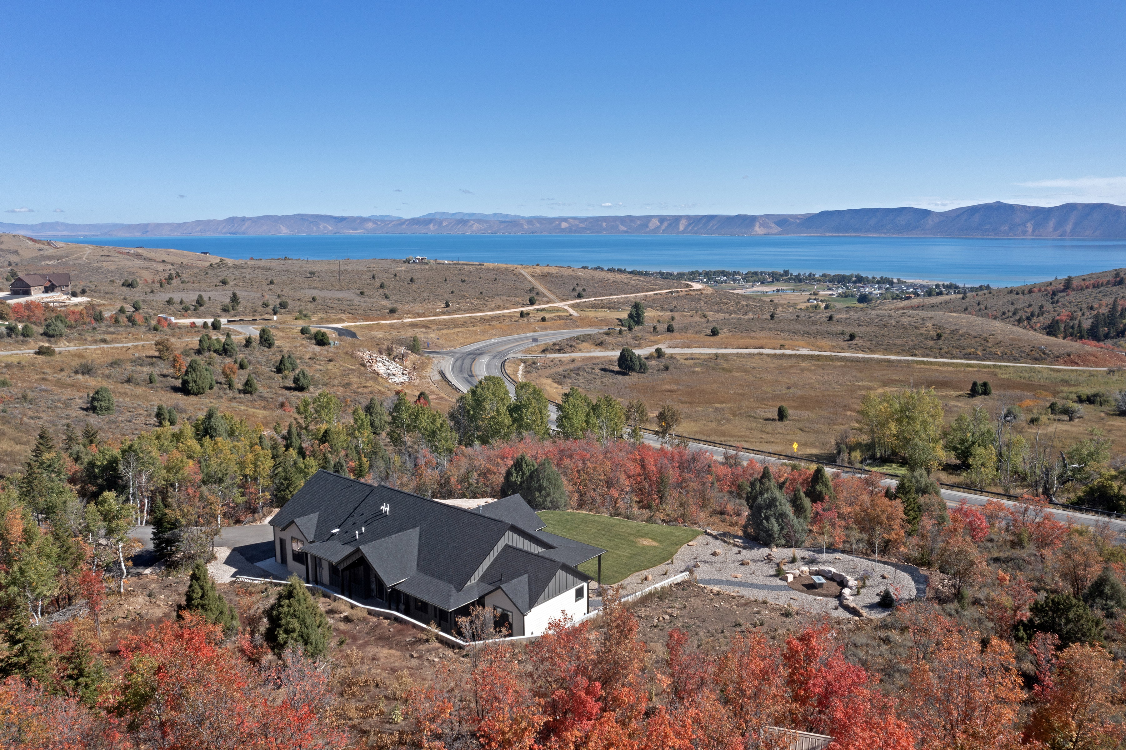 View from above of property with a water and mountain view