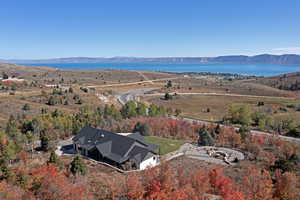 View from above of property with a water and mountain view