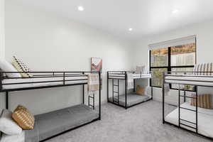 Bedroom featuring light colored carpet and recessed lighting