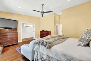 Bedroom with ceiling fan and hardwood / wood-style floors