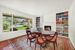 Tiled dining area with built in shelves