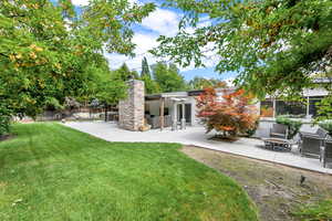 View of yard with a patio area